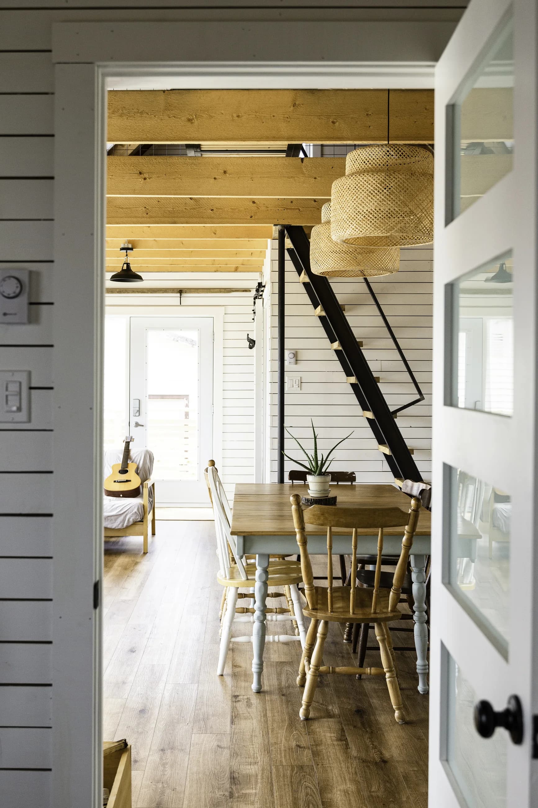 West Lawrencetown dining room and ladder stair seen through an open doorway
